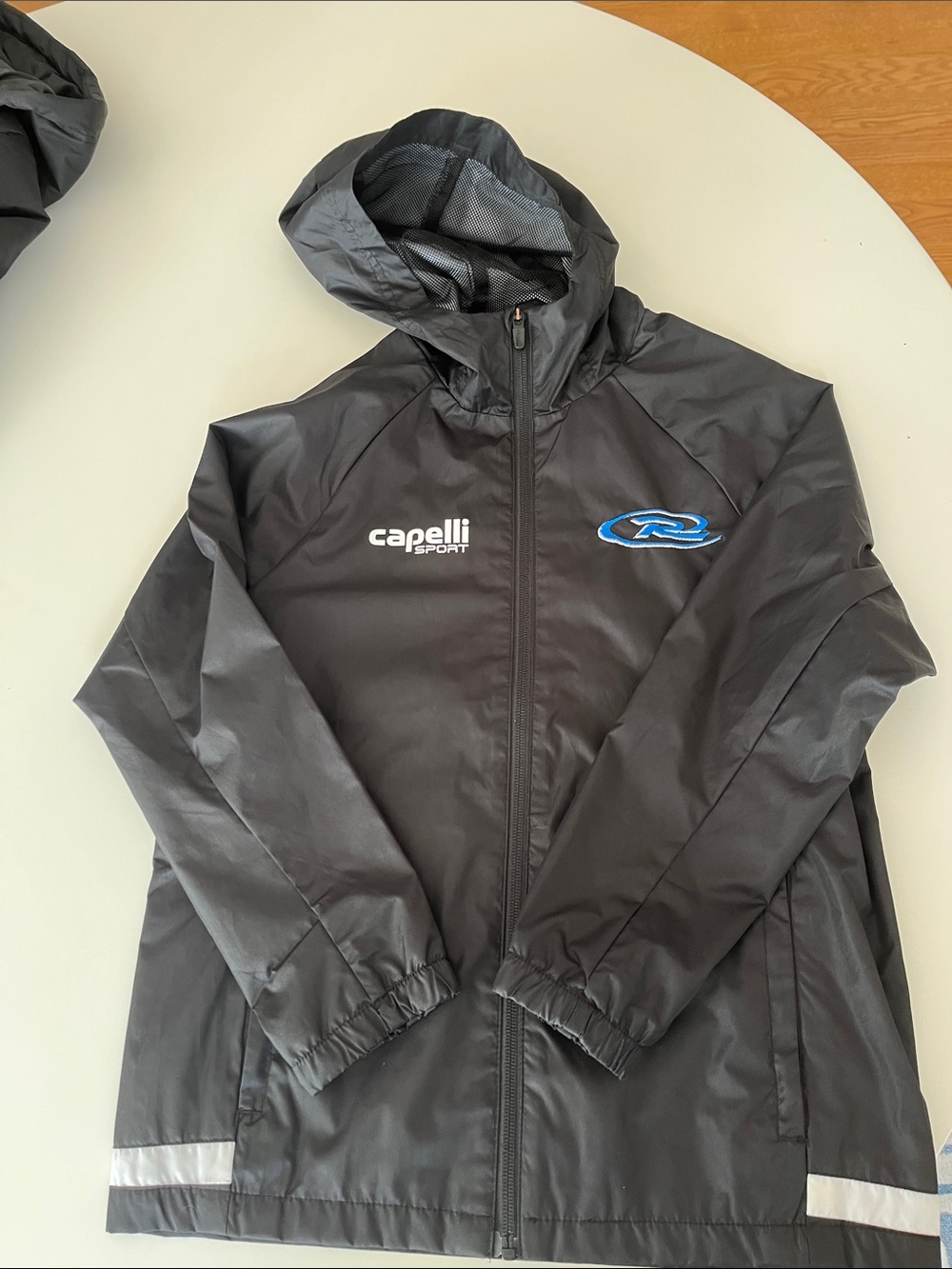 Capelli of New York Black Hooded Rain Jacket with Blue Rush Logo
